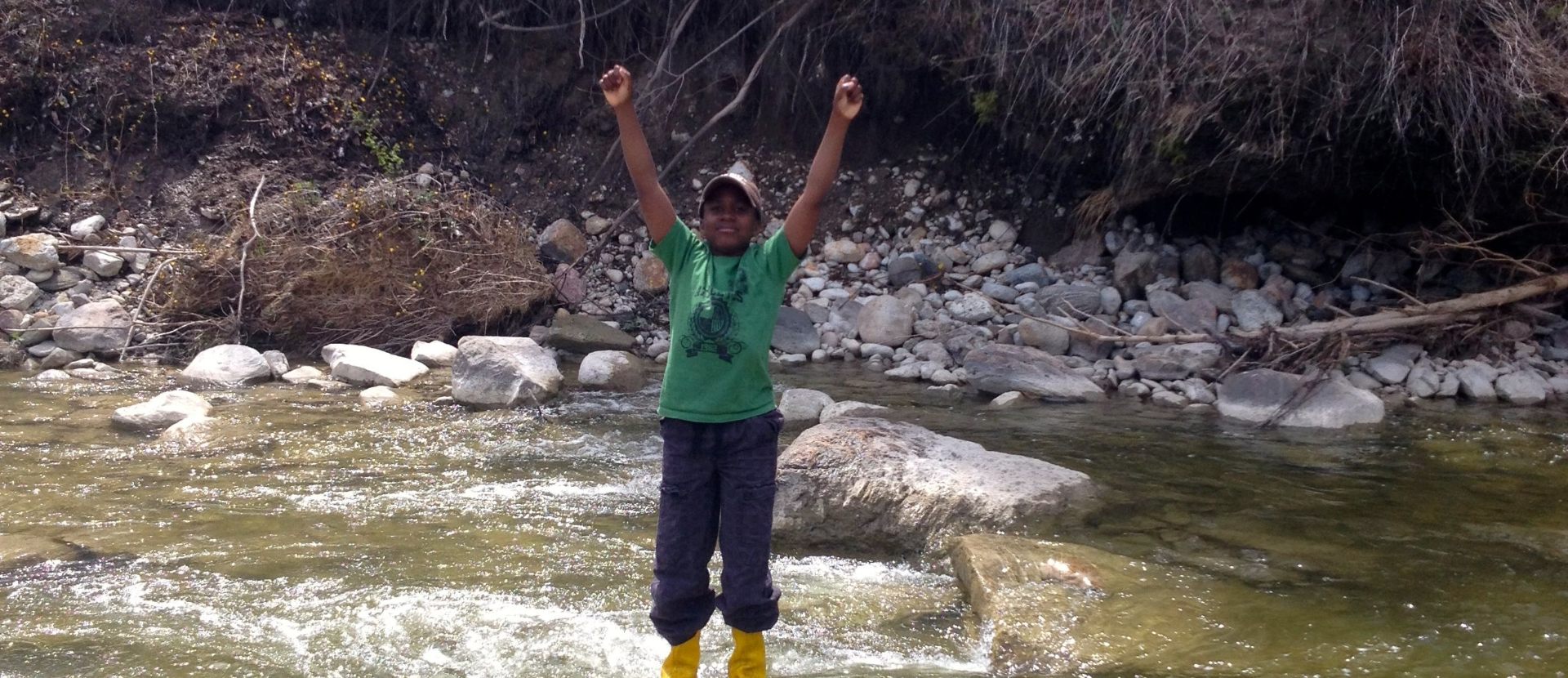 Image with Black Canadian boy in the river